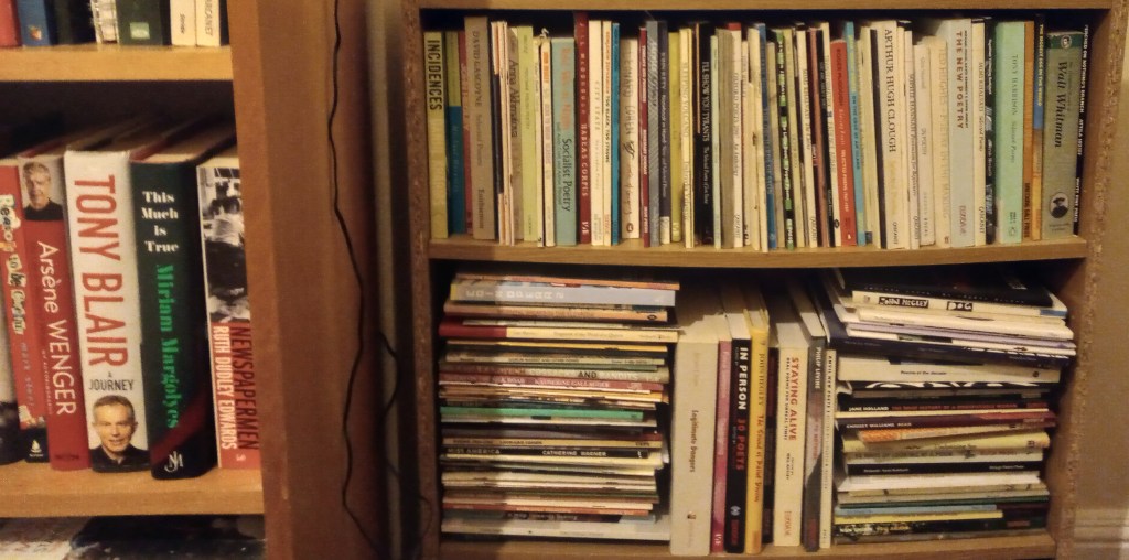 Image of bookshelves full of mostly poetry books with autobiography of Tony Blair to the left